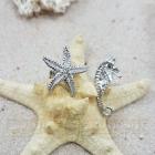 Orecchini cavalluccio e stella in oro con diamante
